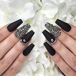 Sophisticated Matte Black Nails with Dazzling Crystal Accents for a Glamorous Touch.