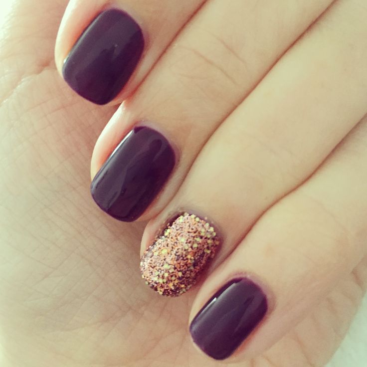 Sophisticated Deep Purple Nail Design with Glitter Accent for Any Occasion.