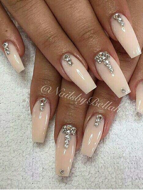 Sleek Elegant Nude Nail Design with Shimmering Rhinestones for a Glamorous Look.