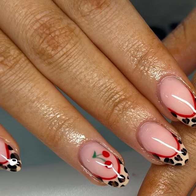 Playful Colorful Nail Design Blending Leopard Print with Vibrant Fruit Motifs.