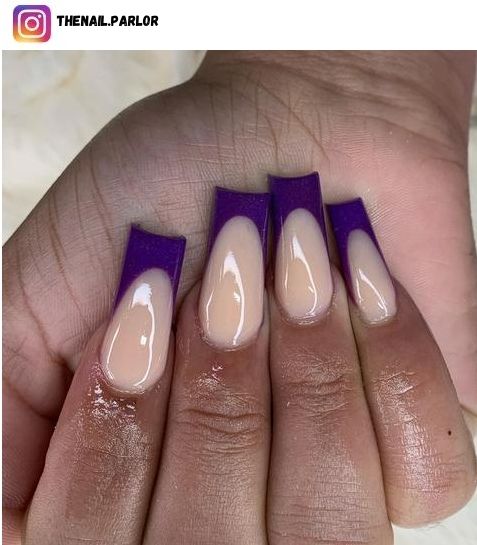 Modern French Nail Design with Bold Purple Tips and Nude Base