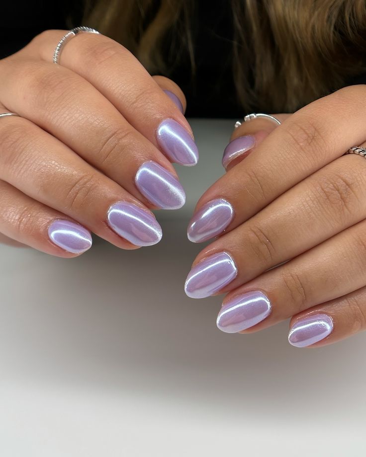 Captivating Glossy Lavender Almond Nails: A Chic Blend of Whimsy and Elegance.