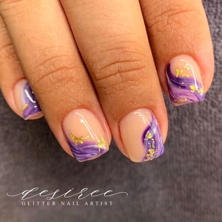 Chic Purple and Nude Nail Design with Gold Accents and Marbled Effect