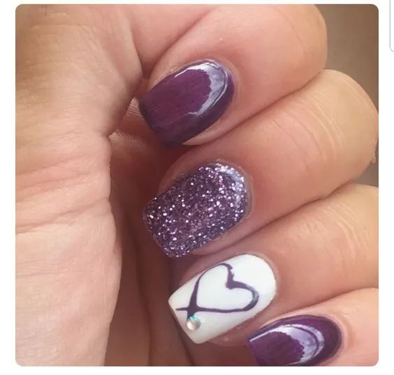 Vibrant Deep Purple and Glitter Nail Design with Playful Heart Accents