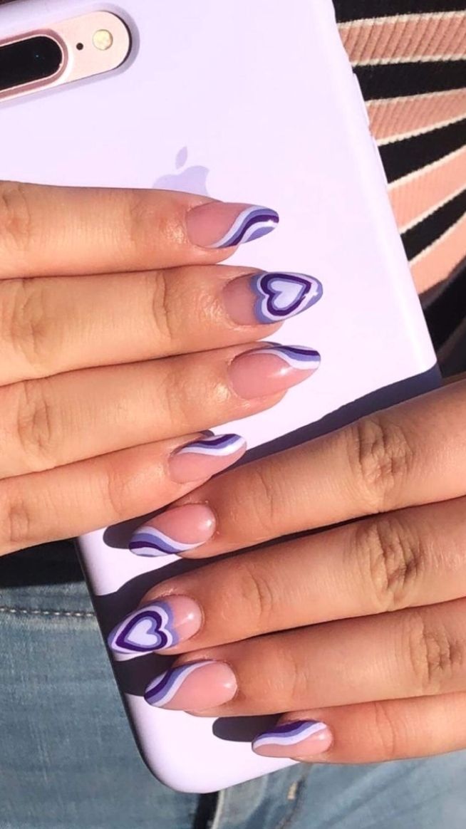 Charming Heart-Inspired Nail Design with Nude Base and Purple Accents.