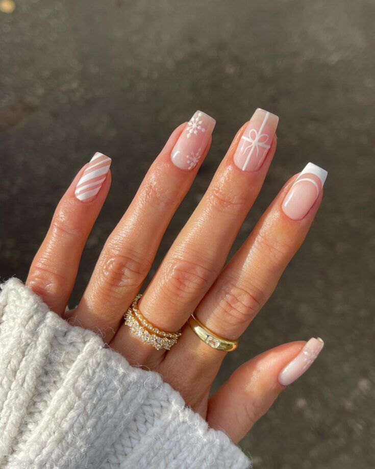 Elegant Chic Nail Design: Soft Nude with Unique White Accents and Minimalist Gold Rings.