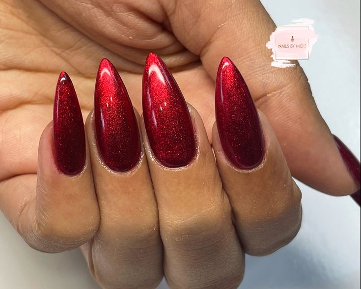 Bold Almond-Shaped Red Nail Design with Glossy Radiance Perfect for Statement Manicures