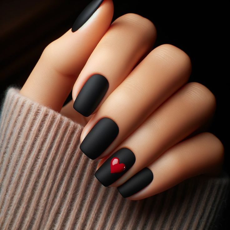 Chic Matte Black Nails with Elegant Bold Red Heart Accent