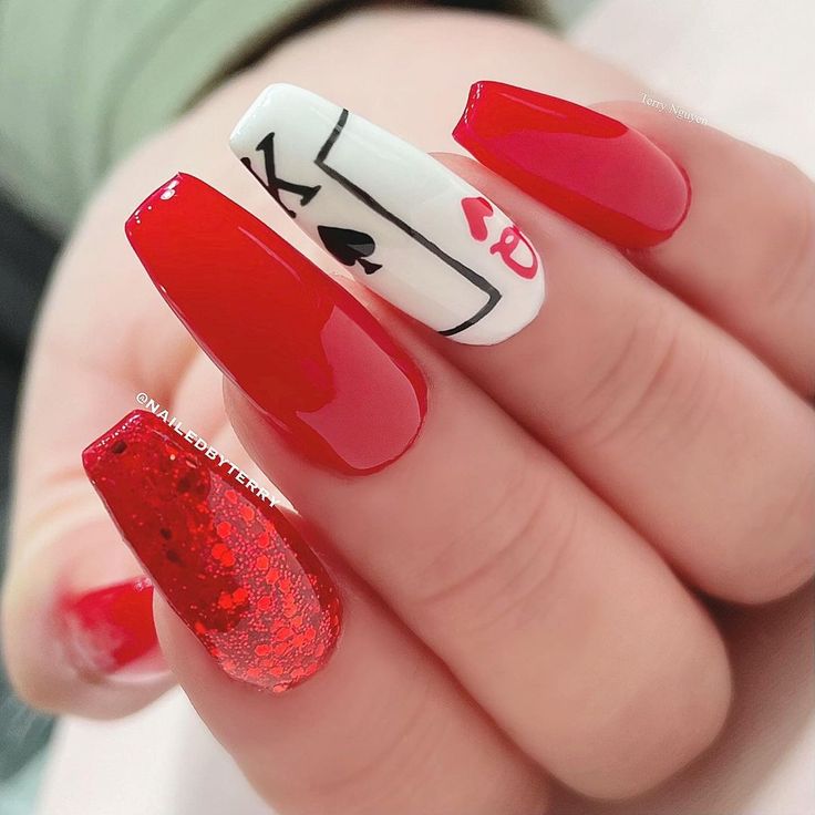 Bold Red and Glossy White Nail Design with Glittery Accents and Playful Motifs.