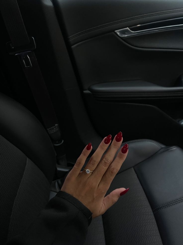 Stunning Glossy Red Nails: Elegance and Glamour Redefined.