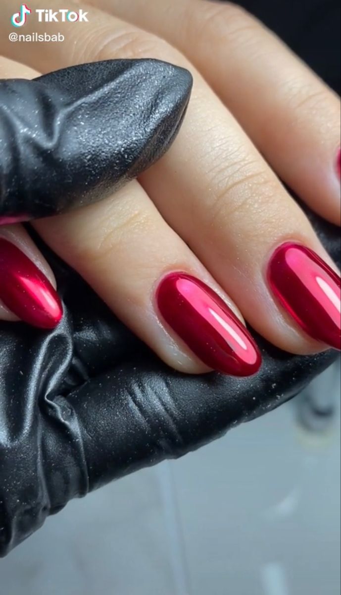 Elegant Glossy Deep Red Almond Nail Design for a Sophisticated Look.