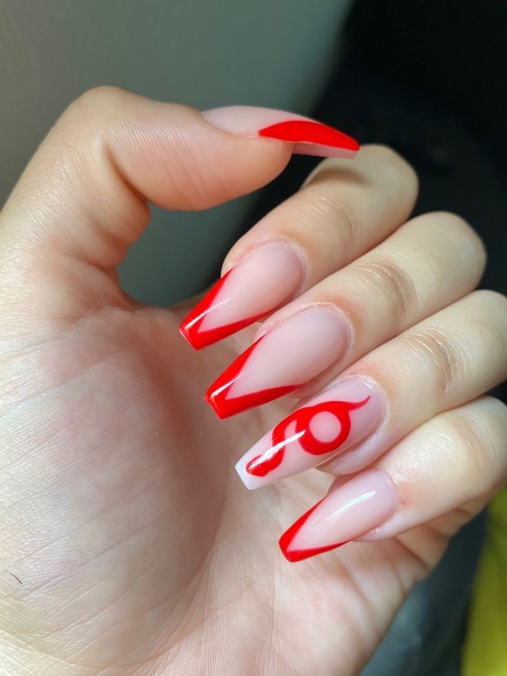 Bold Red Angular Nail Design with Unique Graphic Accents on a Nude Base.