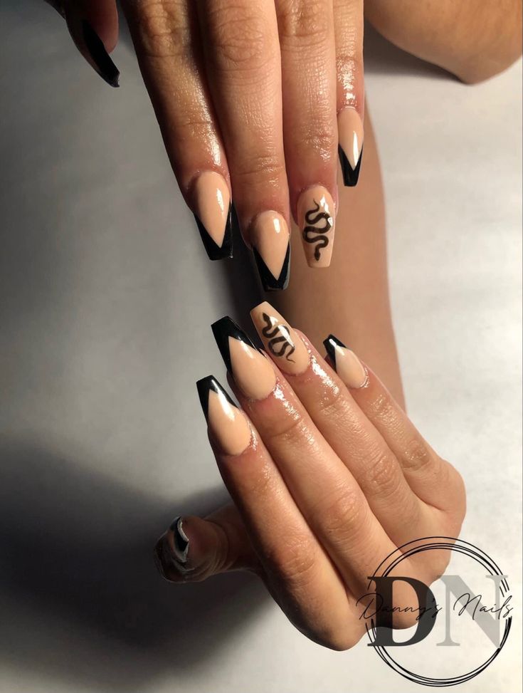 Chic Nail Design: Elegant Neutral and Black Contrast with Pointed Tips