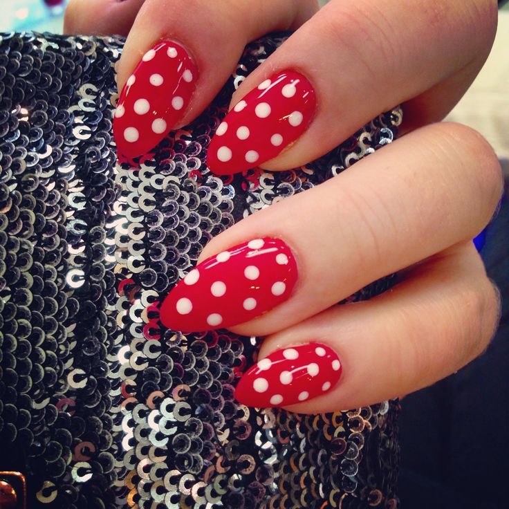 Vibrant Red Polka Dot Nail Design with Glamorous Sequined Background.