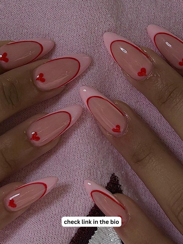 Whimsical Heart-Themed Nail Design with Soft Pink Base and Elegant Red Accents.