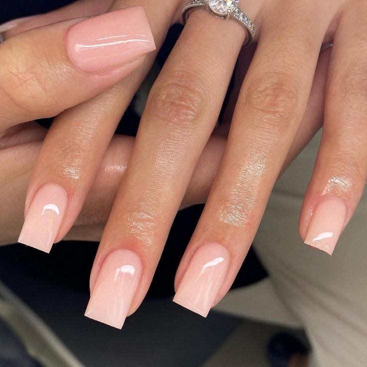 Chic Glossy Nude Nail Design with Square Tips for a Sophisticated Look.