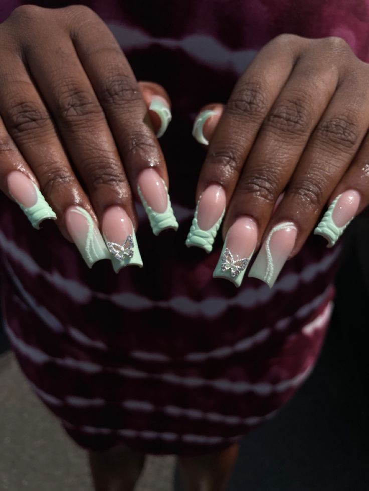 Elegant Colorful Nail Design with Soft Pink, Mint Green, Bows, and Sparkling Accents.