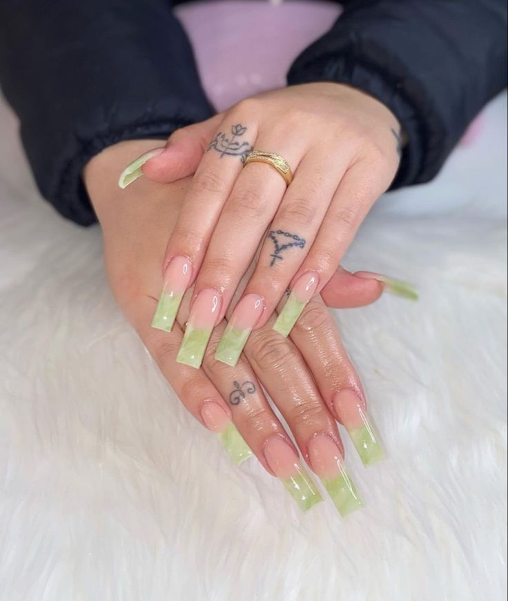 Trendy Ombre Green Gradient Nail Design with Elegant Touches and Glossy Finish