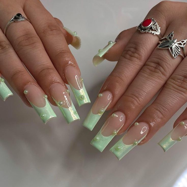 Elegant Mint Green Nail Design with Translucent Accents and Glossy Finish.