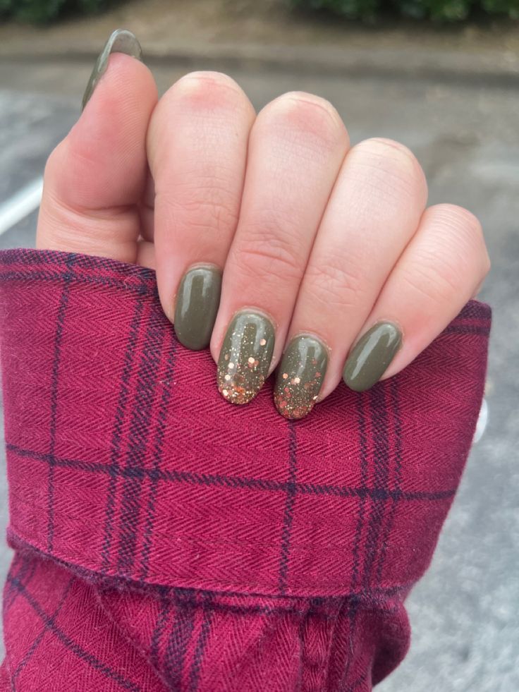 Chic Olive Green Nail Design with Gold Glitter Accents for a Cozy, Glamorous Look.