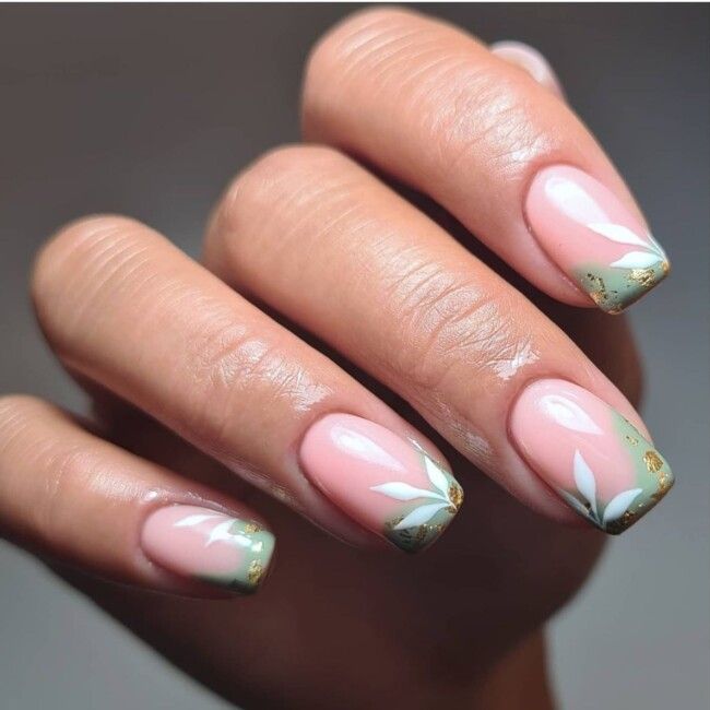 Elegant Floral Nail Design with Soft Pink Base and Gold Accents