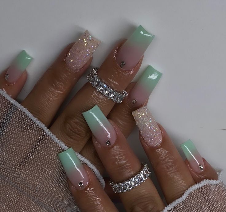 Elegant Gradient Mint Green Nail Design with Glitter and Jewel Accents.