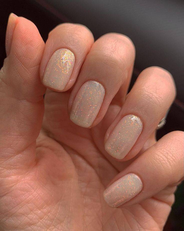 Elegant Minimalist Nail Design with Sheer Milky Base and Holographic Shimmer