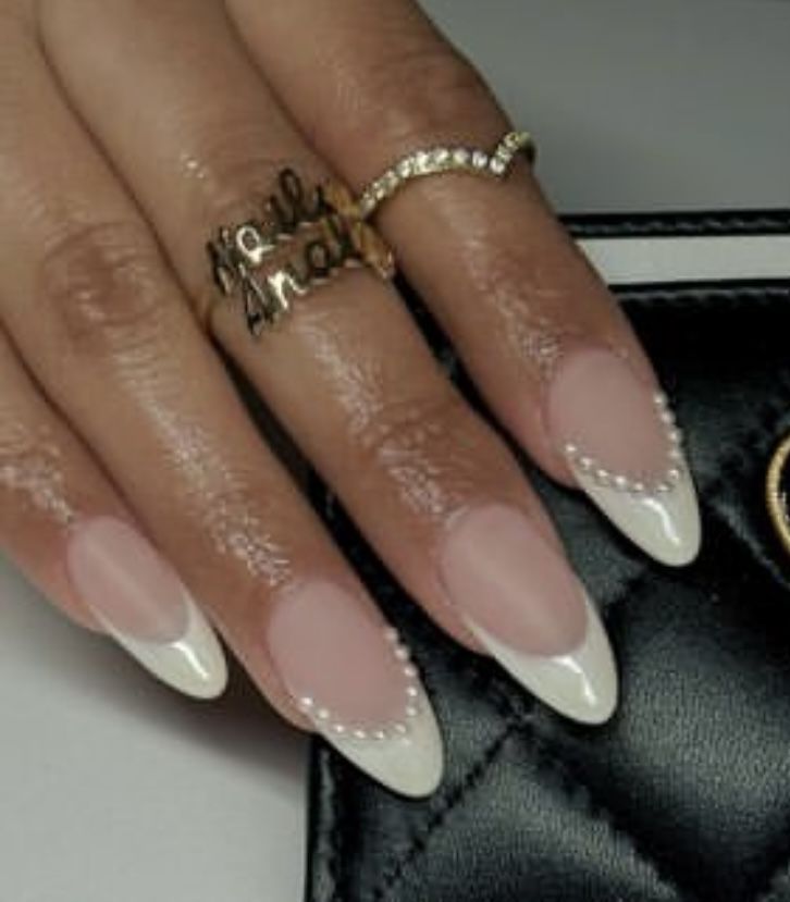 Sophisticated Almond-Shaped Nail Design with Soft Pink Base and Pearl-Accented White Tips.