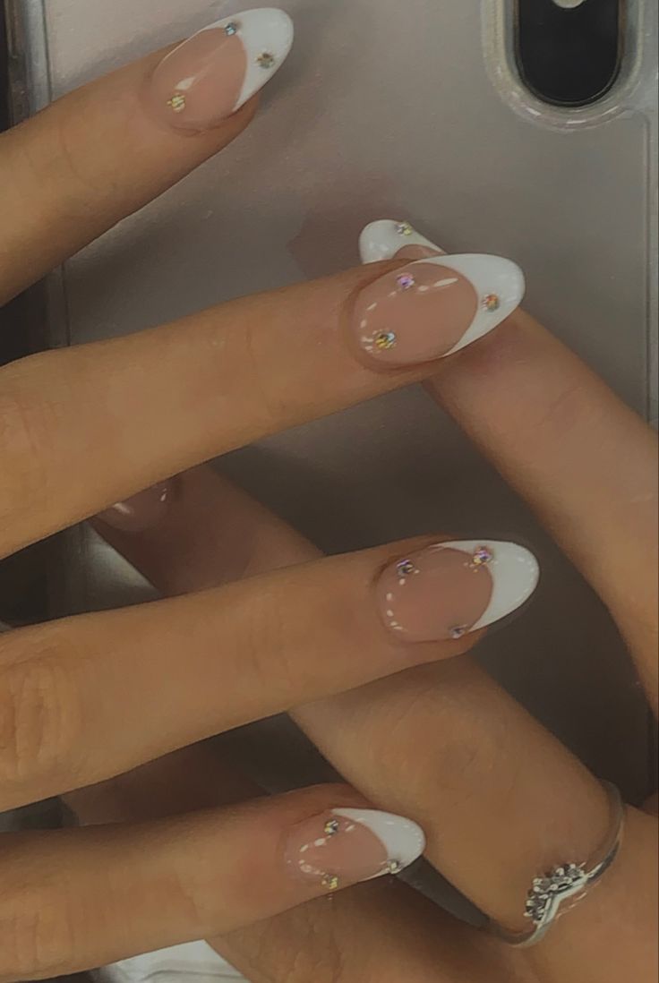 Sophisticated French Tip Nail Design with Rhinestones for Versatile Elegance.