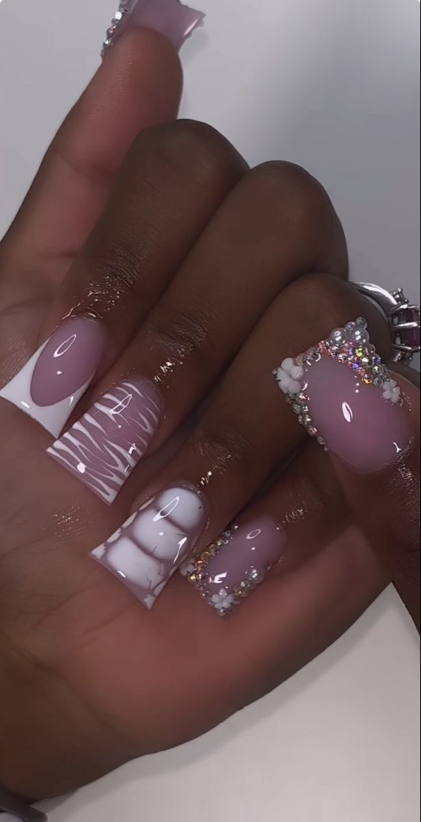 Chic and Elegant Nail Design with Soft Pinks, Bold Whites, and Glamorous Gemstones