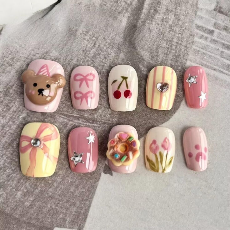 Playful Pastel Nail Art with Charming Charms and Cheerful Motifs