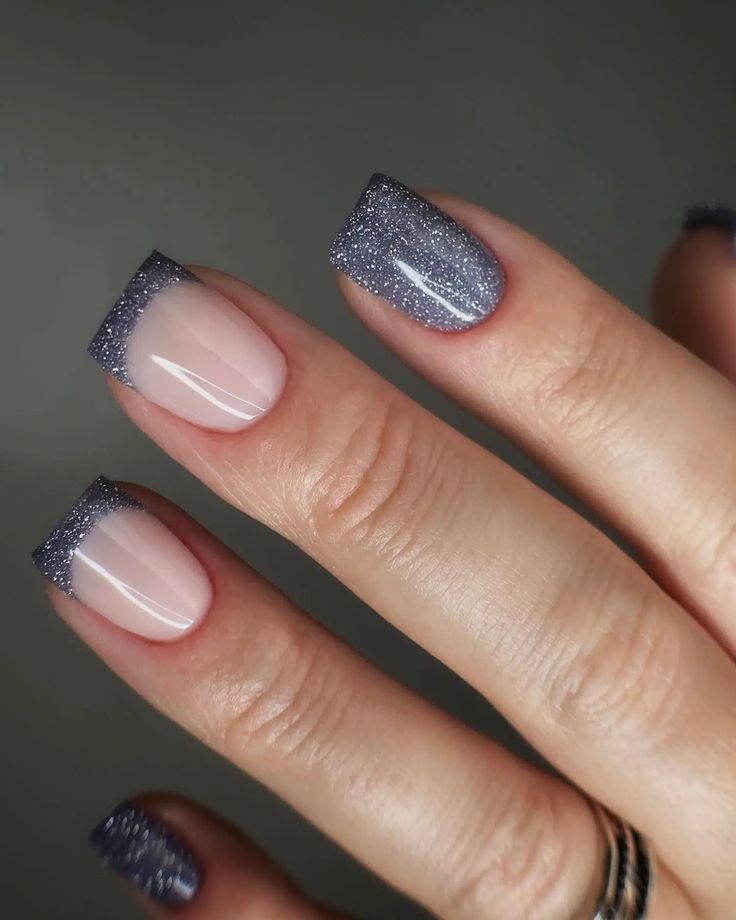 Chic Ombre Nail Design: Elegant Dark Purple to Nude Transition with Glamorous Sparkle.