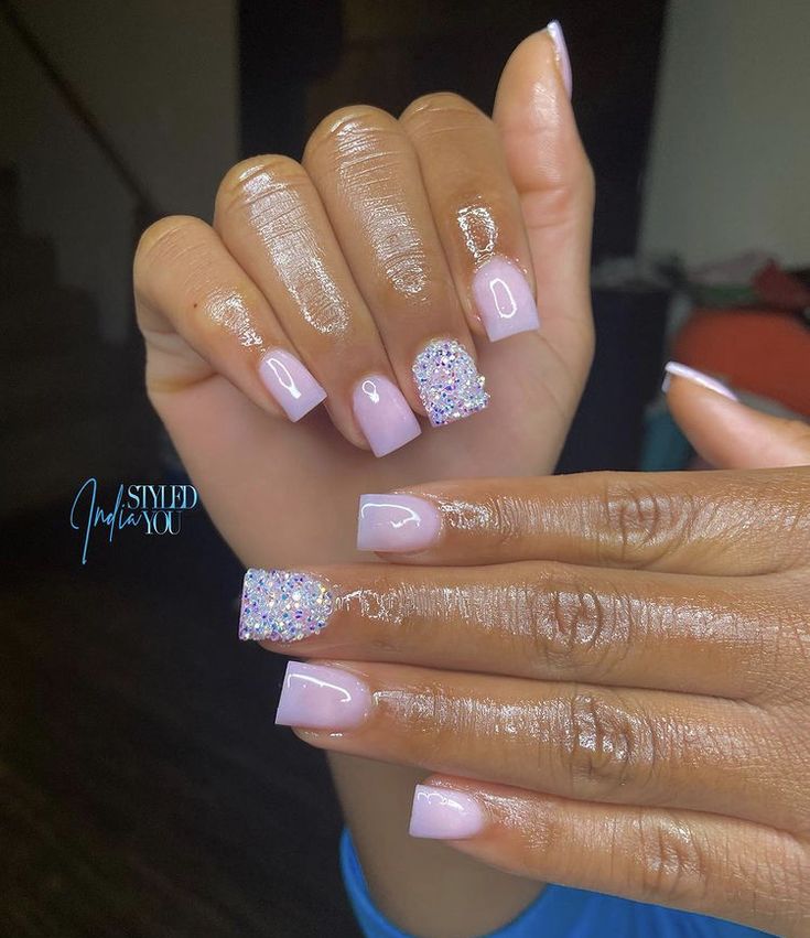 Sophisticated Soft Pink Nail Design with Shimmering Crystal Accents