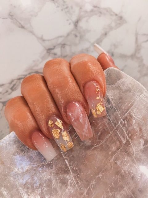 Sophisticated Nail Design with Blush Hues, Translucent Finishes, and Luxurious Gold Accents.