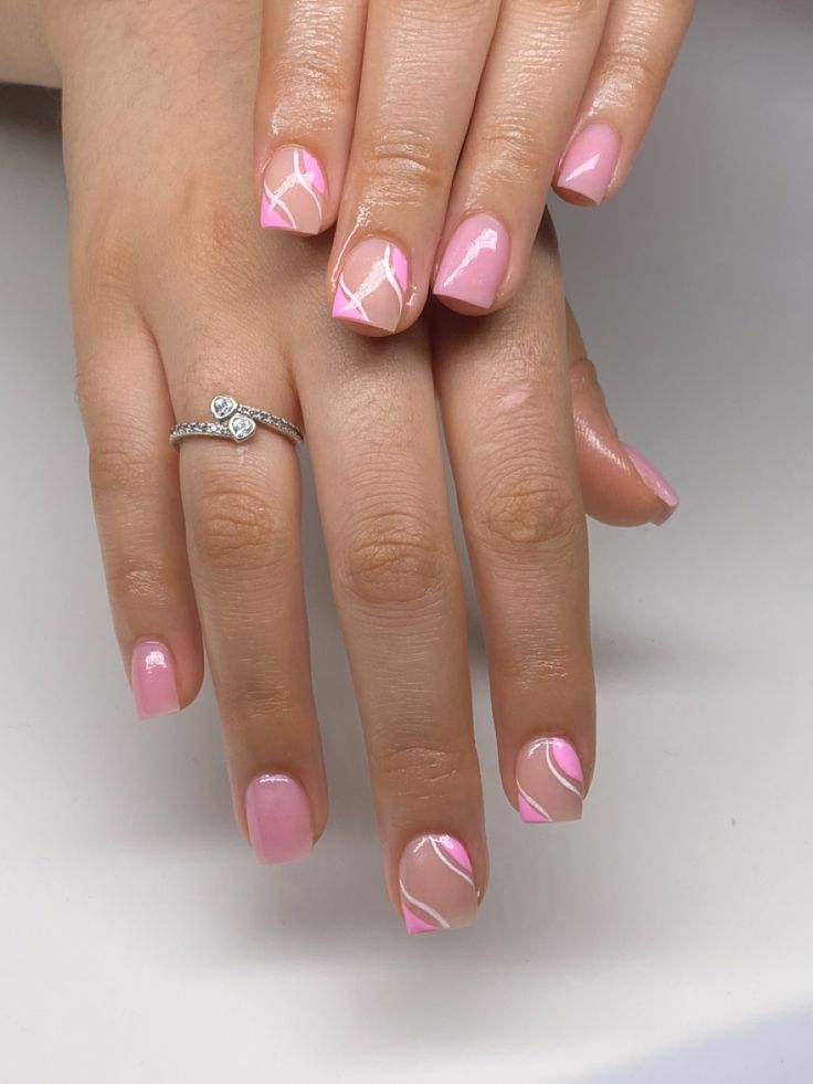 Elegant Soft Pink Nail Design with Sophisticated Diagonal Accents.