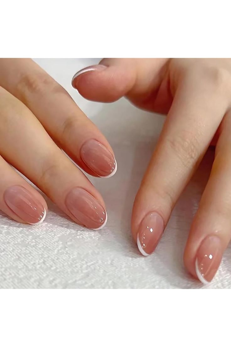 Chic and Sophisticated Elegant Nude Nail Design with Subtle French Tips.