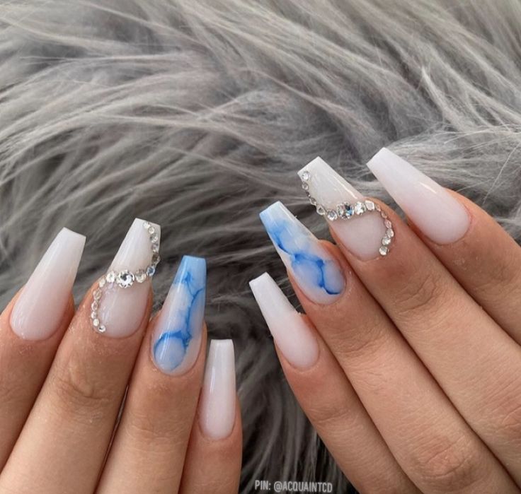 Chic Blue and White Marbled Nail Design with Sparkling Rhinestones.