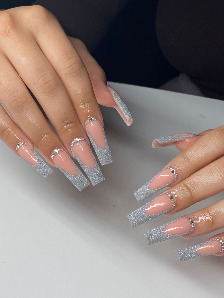 Chic Gradient Long Nails with Pink Tips and Sparkling Silver Glitter Accents.