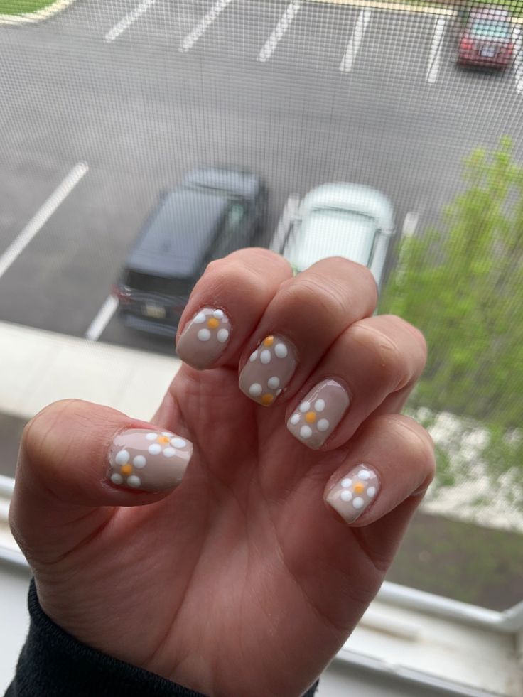 Cheerful Polka Dot Nail Design on Soft Beige Base