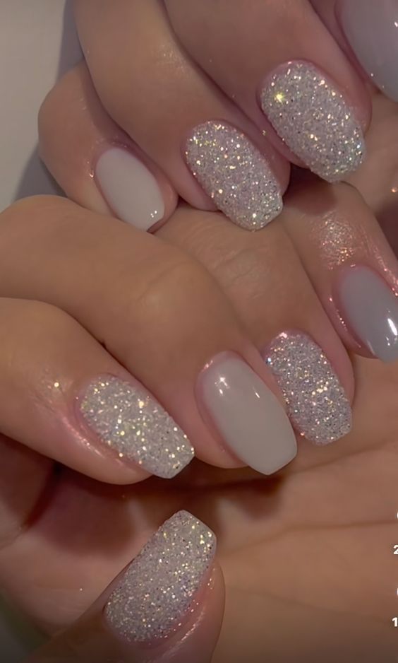 Chic Matte and Shimmer Nail Design in Pale Gray with Sparkling Silver Accents.