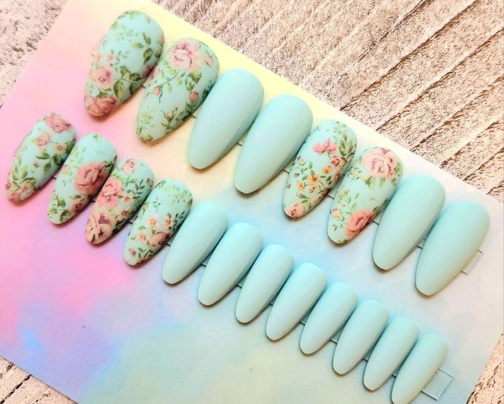 Chic Pastel Nail Design with Soft Blue and Floral Patterns