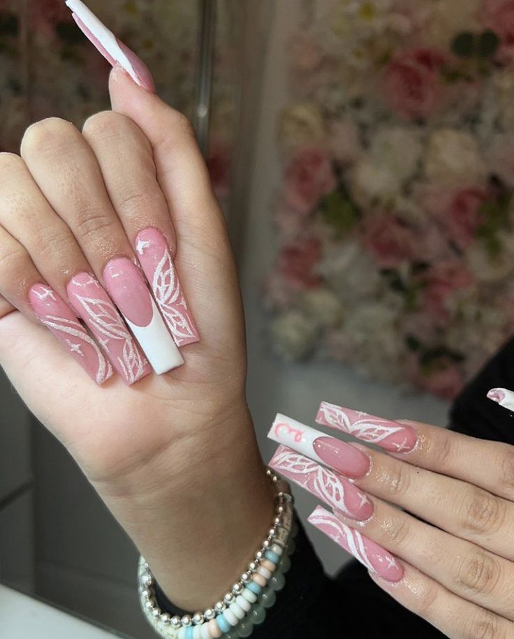 Elegant Pink-Tipped Nail Design with Delicate White Details for a Sophisticated Touch.