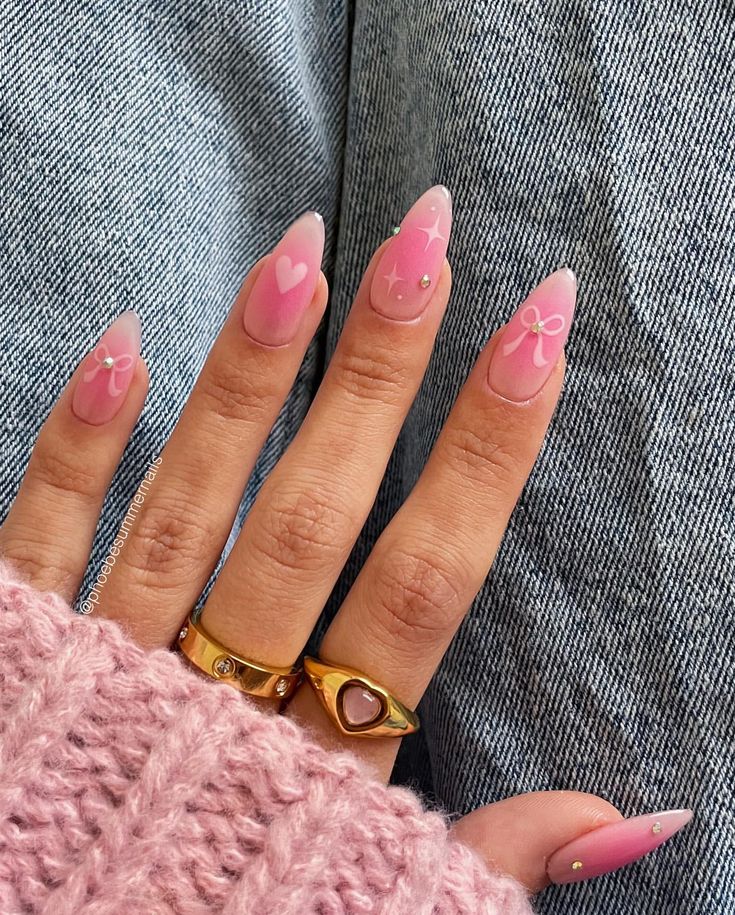 Whimsical Pink Gradient Nail Design with Hearts and Bows