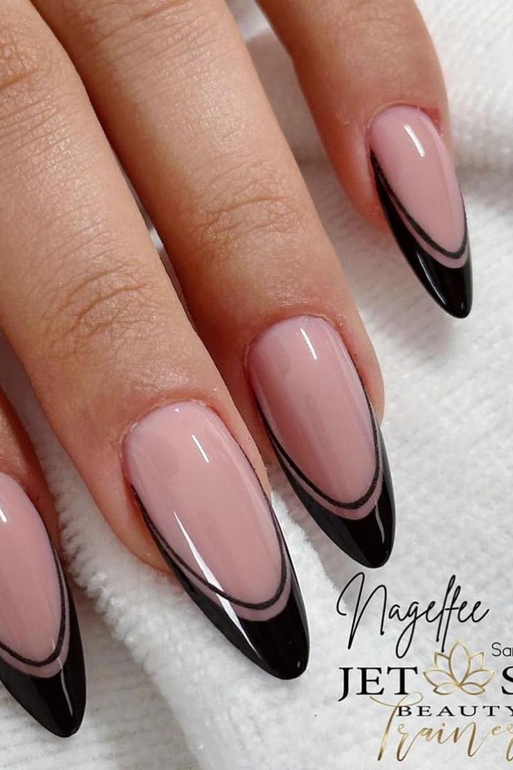 Stylish Stiletto Nail Design: Chic Nude and Black Contrast with Elegant Curved Line.