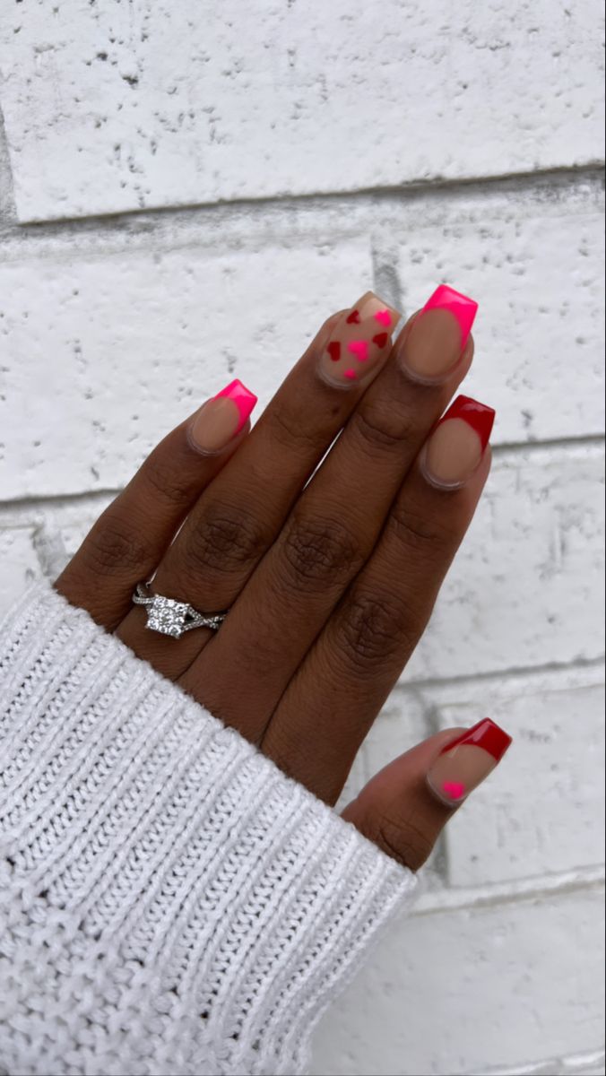 Playful Pink and Red Nail Design with Whimsical Heart Accents on a Nude Base