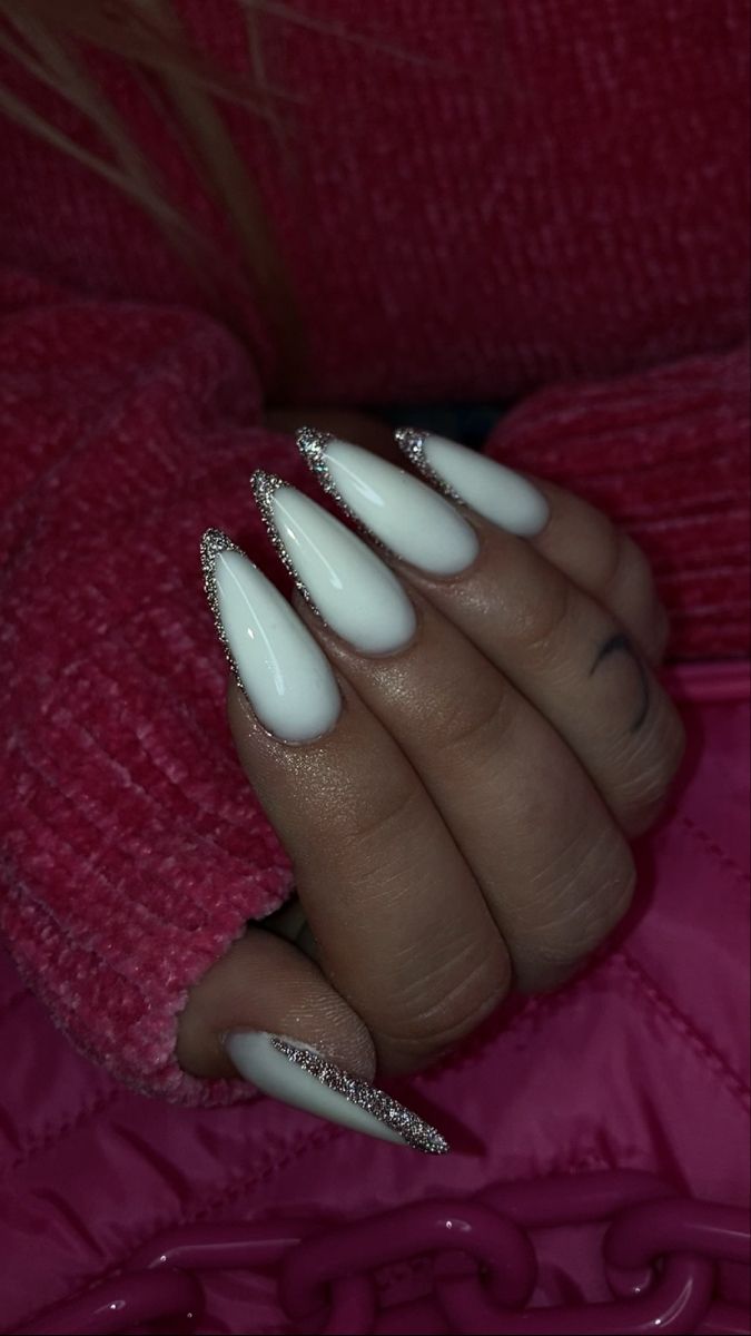 Sophisticated Elegance: White Nails with Shimmering Silver Tips for Glamorous Occasions.