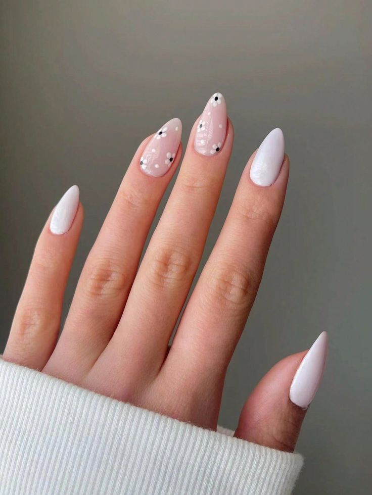 Chic Elegant Nail Design: Soft Pink and Glossy White with Stylish Pointed Shape and Delicate Embellishments