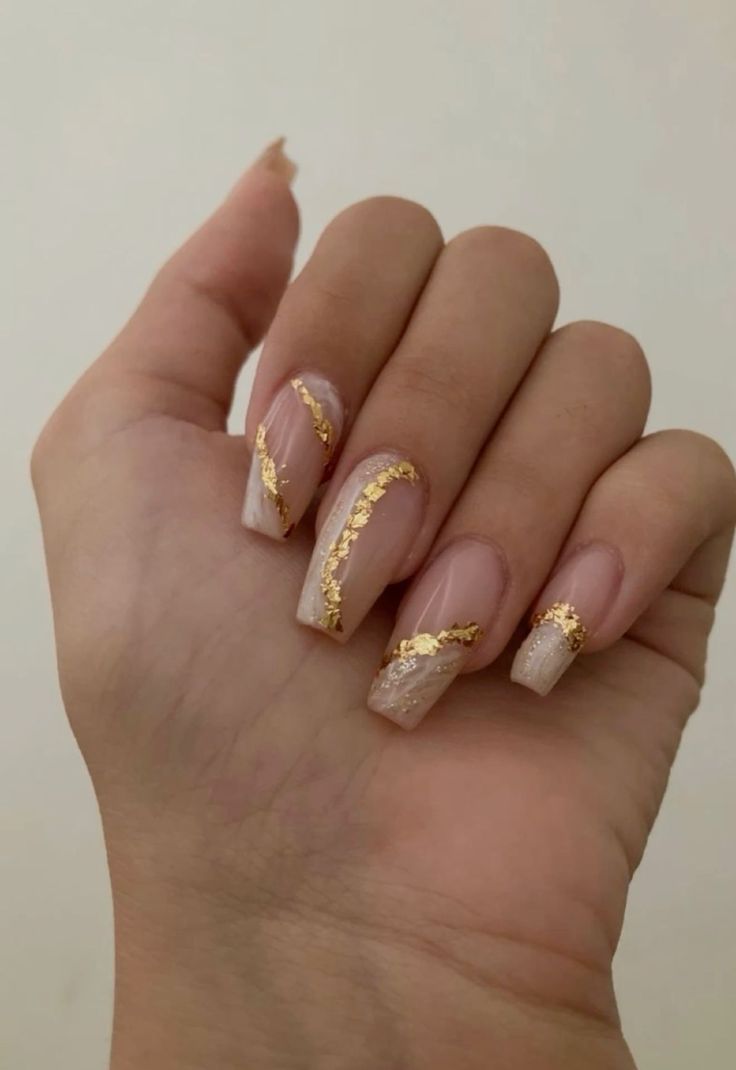 Chic Nude and Clear Nail Design with Luxurious Gold Foil Accents