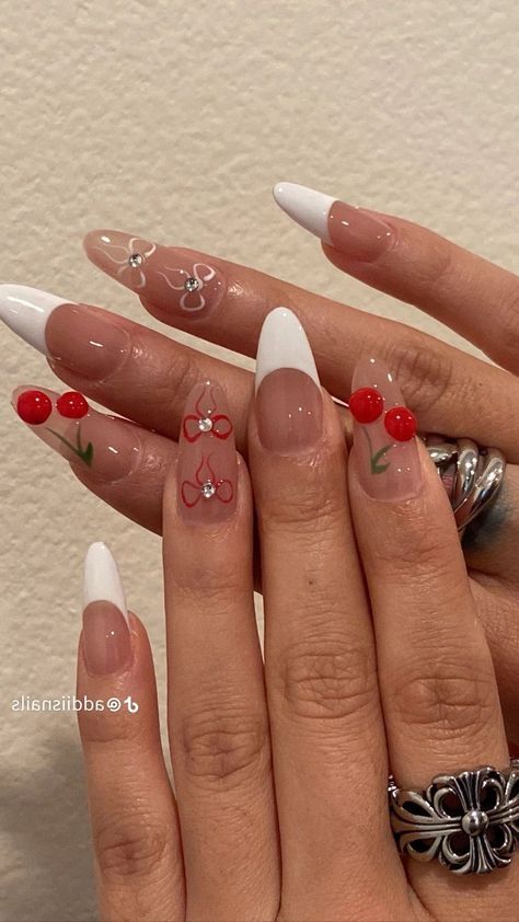 Playful Cherry Motif Nail Design with Elegant French Tips and Sparkling Accents.