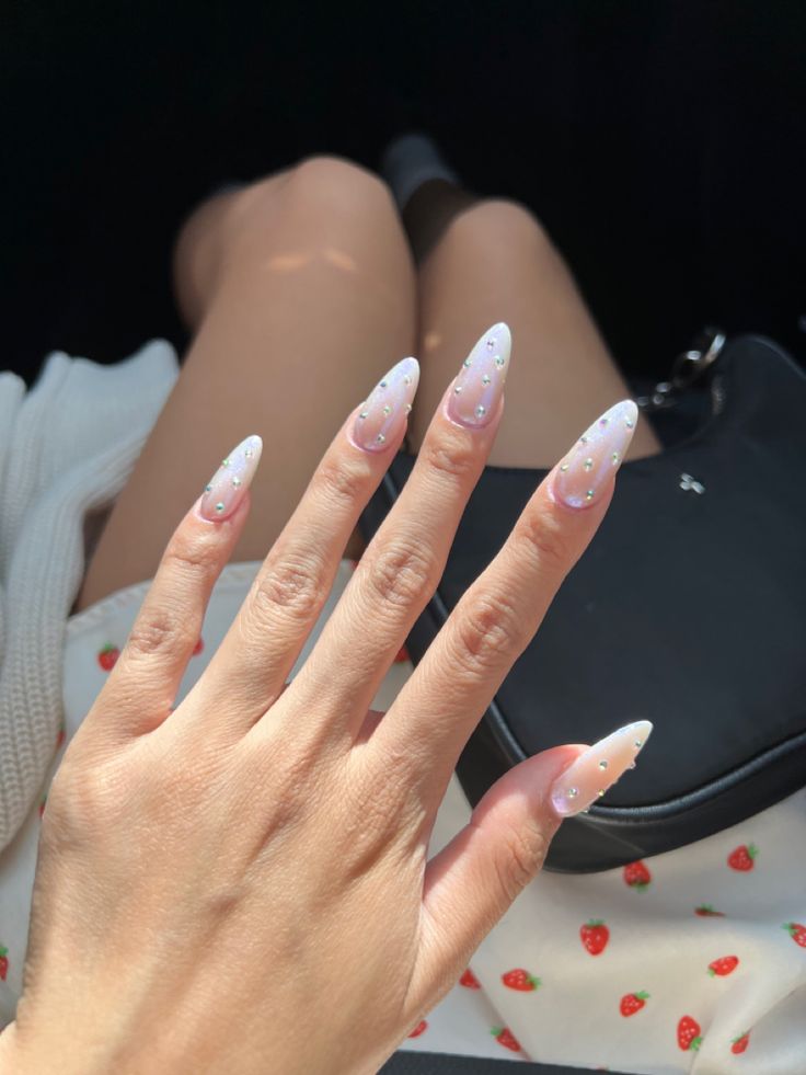 Chic Ombre Almond-Shaped Nails with Gem Embellishments for Any Occasion.